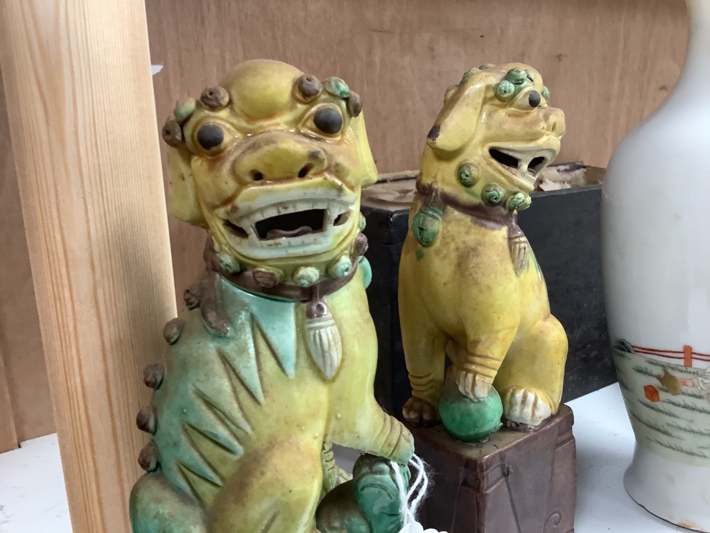 A pair of Chinese lion-dogs dogs, porcelain bowl and a vase, tallest 24cm